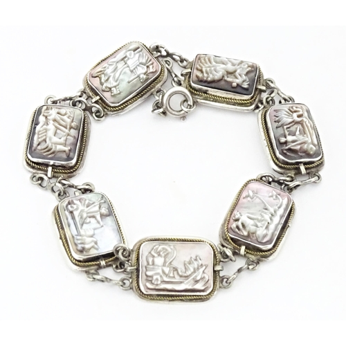 736 - A Continental .800 silver bracelet set with carved abalone shell panels depicting classical scenes. ... 