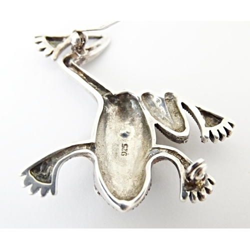 737 - Three assorted brooches to include a silver example formed as a frog with marcasite decoration. 2