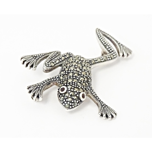 737 - Three assorted brooches to include a silver example formed as a frog with marcasite decoration. 2