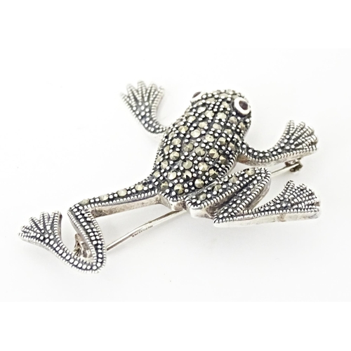 737 - Three assorted brooches to include a silver example formed as a frog with marcasite decoration. 2