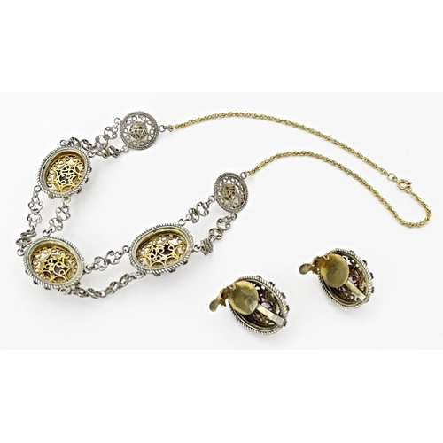 738 - A suite of gilt and white metal jewellery comprising necklace and clip earrings set with amethysts. ... 