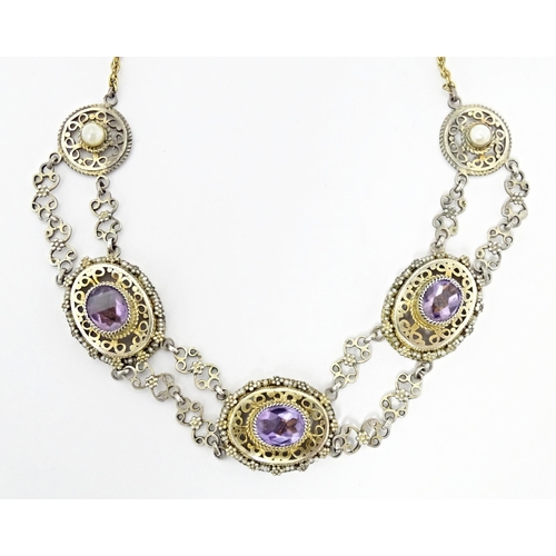 738 - A suite of gilt and white metal jewellery comprising necklace and clip earrings set with amethysts. ... 