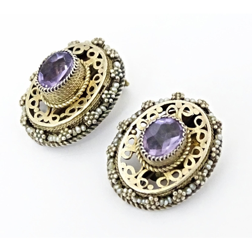 738 - A suite of gilt and white metal jewellery comprising necklace and clip earrings set with amethysts. ... 