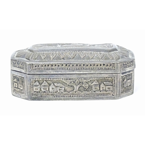 419 - A white metal snuff box with hinged lid and landscape decoration, possibly Indian / West Indies. App... 