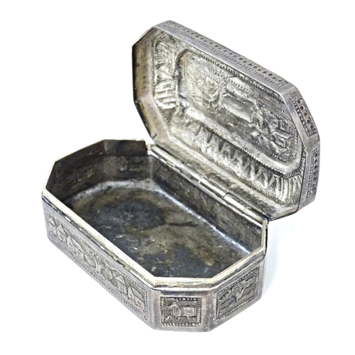 419 - A white metal snuff box with hinged lid and landscape decoration, possibly Indian / West Indies. App... 