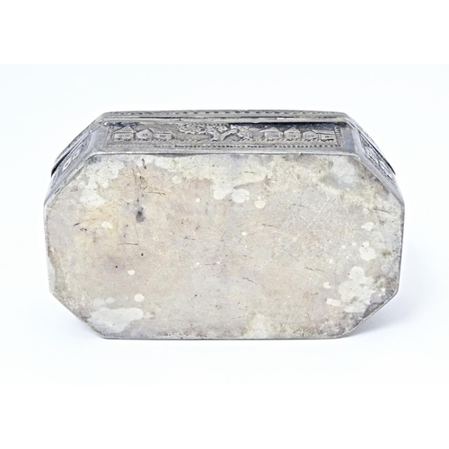 419 - A white metal snuff box with hinged lid and landscape decoration, possibly Indian / West Indies. App... 