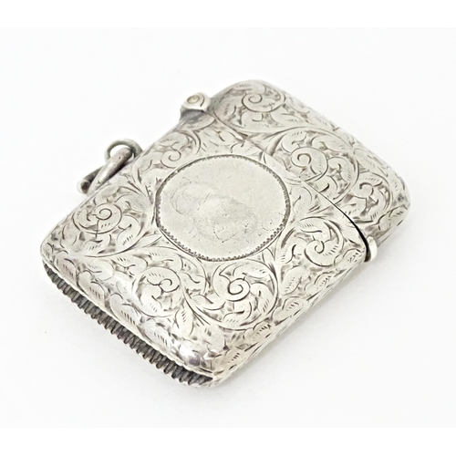 420 - A Victorian vesta case with engraved acanthus scroll decoration, hallmarked Birmingham 1897. Approx.... 