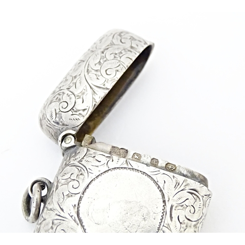 420 - A Victorian vesta case with engraved acanthus scroll decoration, hallmarked Birmingham 1897. Approx.... 