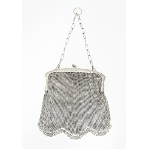 421 - An early 20thC silver bag / purse with mesh body and hanging chain, the top marked with silver impor... 