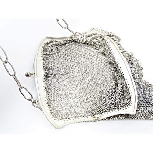 421 - An early 20thC silver bag / purse with mesh body and hanging chain, the top marked with silver impor... 