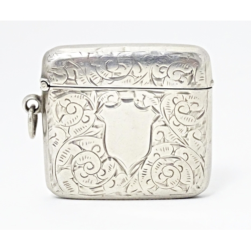 422 - A Victorian vesta case with engraved acanthus scroll decoration, hallmarked Birmingham 1899, William... 