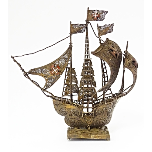 426 - A Portuguese .835 silver gilt filigree model of a sailing boat / ship. Approx. 6