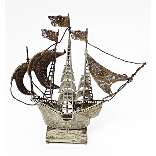 426 - A Portuguese .835 silver gilt filigree model of a sailing boat / ship. Approx. 6