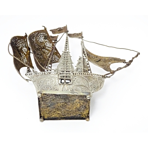 426 - A Portuguese .835 silver gilt filigree model of a sailing boat / ship. Approx. 6