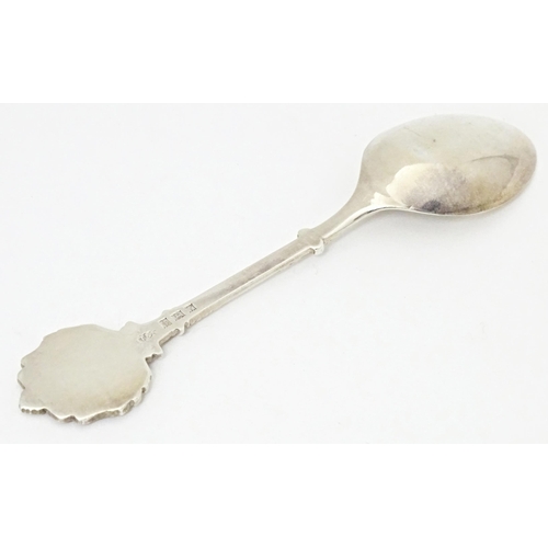 433 - A silver teaspoon with RNLI detail to handle, hallmarked Birmingham 1973, maker Turner and Simpson. ... 