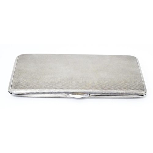 436 - A large Art Deco silver cigarette case with engine turned decoration and gilded interior, hallmarked... 