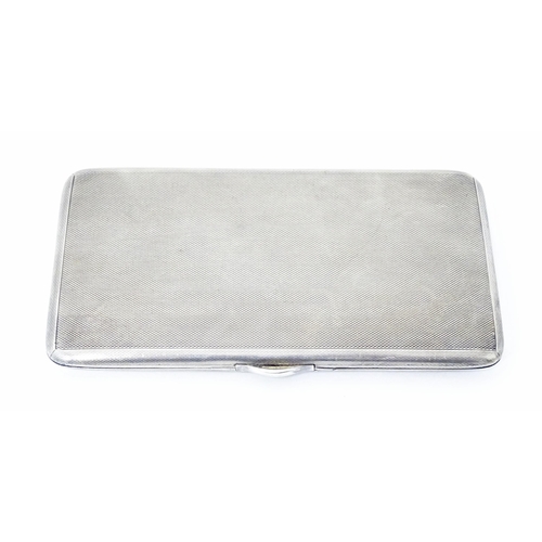 436 - A large Art Deco silver cigarette case with engine turned decoration and gilded interior, hallmarked... 