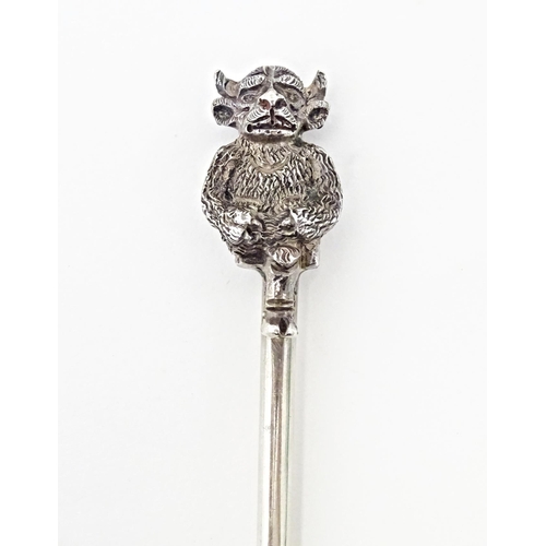 444 - A silver bread fork the handle with finial formed as a Lincoln Imp. Hallmarked Birmingham 1913. 7 1/... 