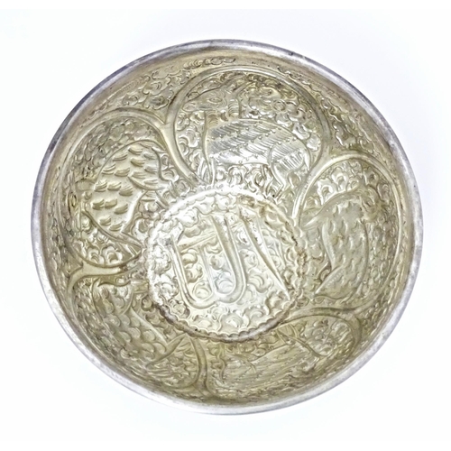 489 - A white metal bowl with embossed animal decoration. Possibly Indian / Persian. Approx 5