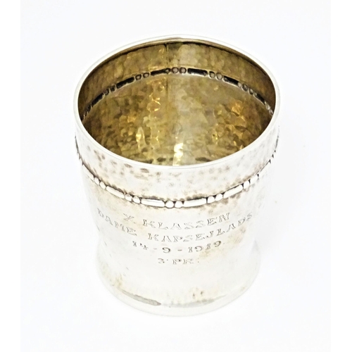 491 - Scandinavian silver : A Danish silver beaker with hammered finish. Marked under for assay master Chr... 