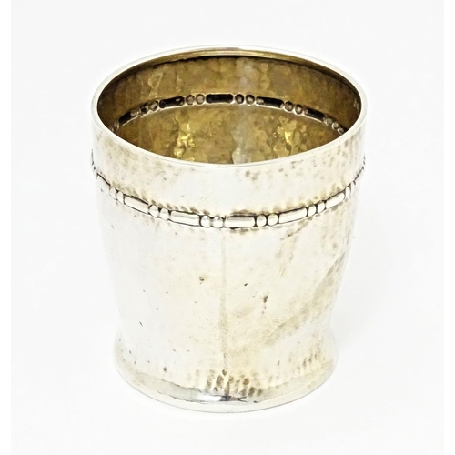 491 - Scandinavian silver : A Danish silver beaker with hammered finish. Marked under for assay master Chr... 