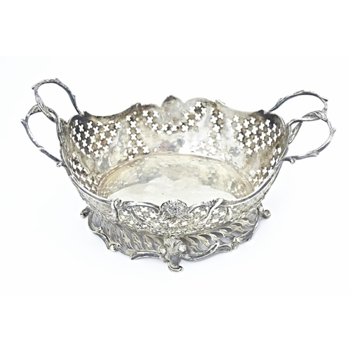 394 - A Victorian Continental silver bowl of basket form with twin handles and import marks for London 189... 