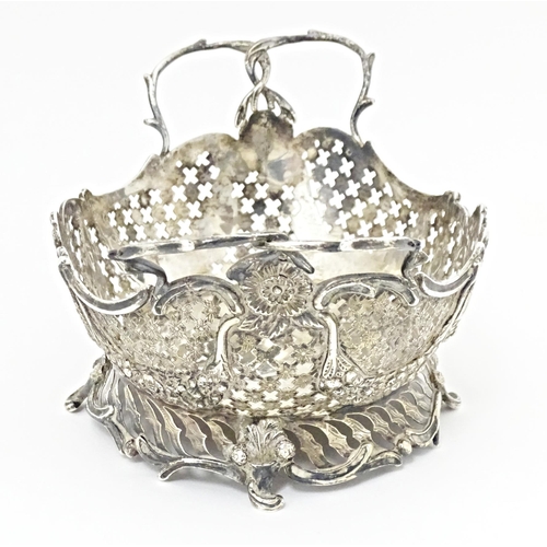 394 - A Victorian Continental silver bowl of basket form with twin handles and import marks for London 189... 