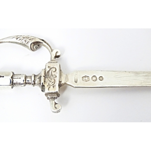 396 - A Dutch silver letter opener modelled as a sword. Approx. 6