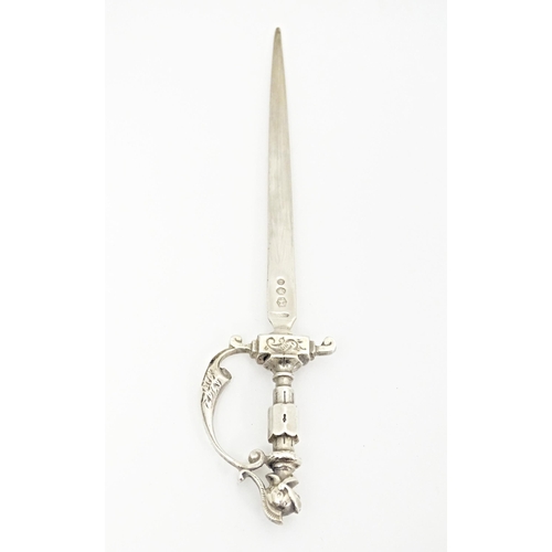 396 - A Dutch silver letter opener modelled as a sword. Approx. 6