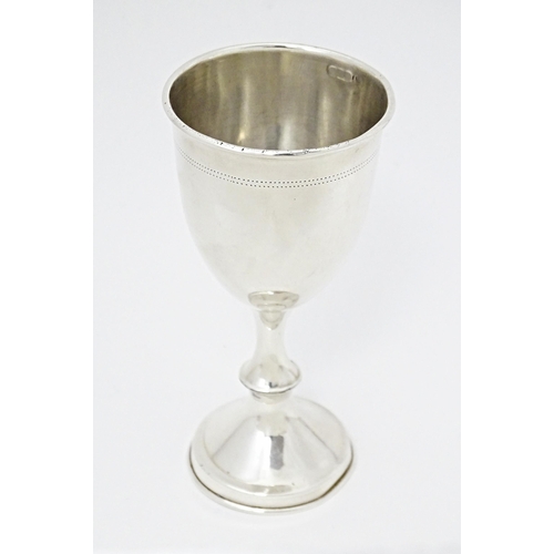 398 - A silver pedestal cup with weight base, hallmarked London 1907. Approx. 6