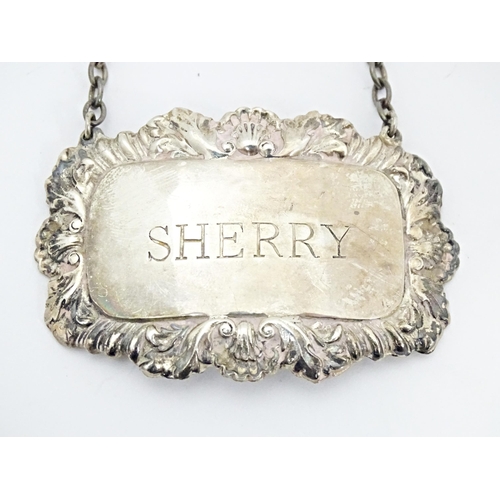 492 - A matched pair of silver 'Sherry' decanter labels. Hallmarked Birmingham  1958 / 1963 Ph Vogel & Co