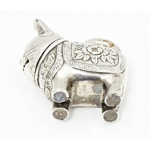 493 - An Oriental white metal novelty pepperette formed as a feline / cat /  neko. Marked with character m... 