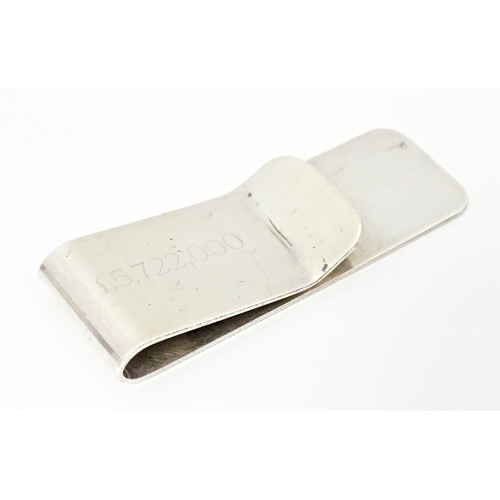 494 - A hallmarked silver money clip engraved '£5,722,000', assayed in Birmingham with Makers mark AR. App... 