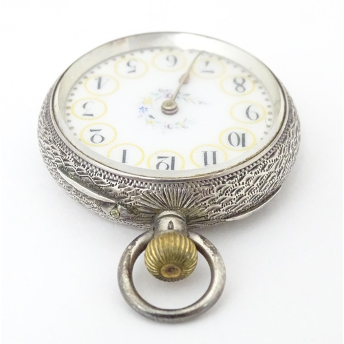 771 - A Continental .935 silver ladies fob watch, the white enamel dial with floral detail. Approx. 1 1/2