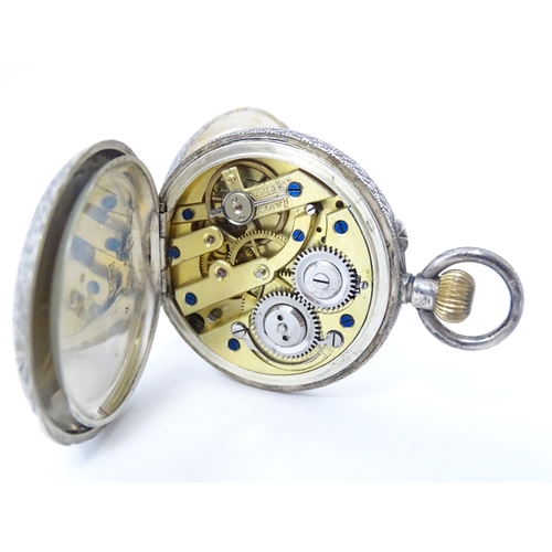 771 - A Continental .935 silver ladies fob watch, the white enamel dial with floral detail. Approx. 1 1/2