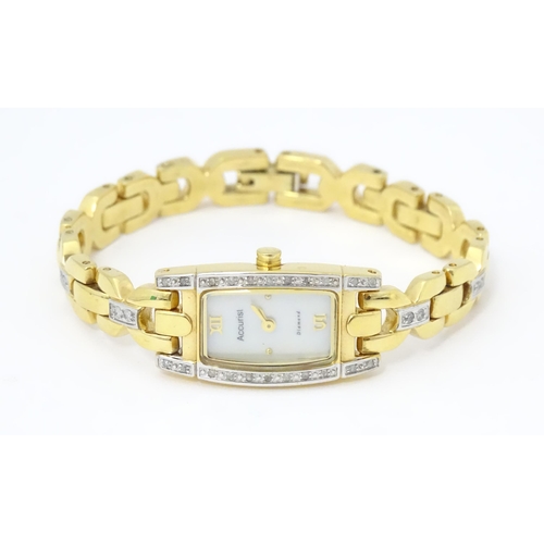 778 - A ladies Accurist wrist watch with mother of pearl dial and chip set diamonds to case and strap. App... 