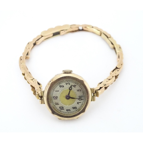 779 - A ladies 9ct gold wristwatch. Dial approx. 3/4