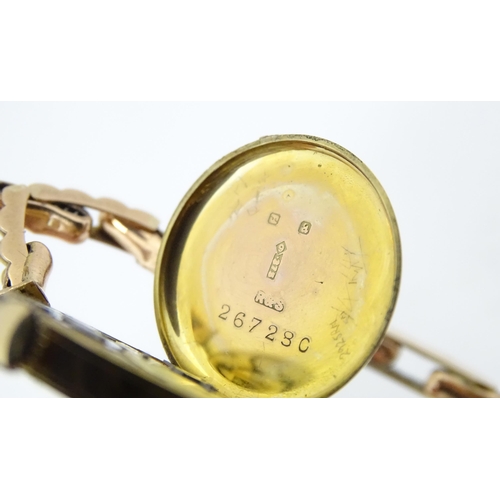 779 - A ladies 9ct gold wristwatch. Dial approx. 3/4