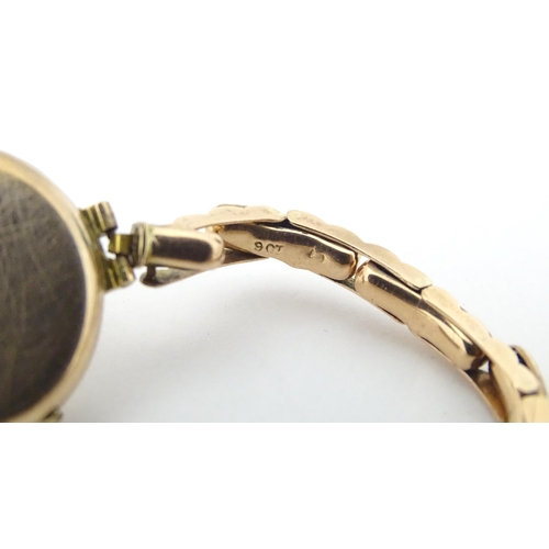 779 - A ladies 9ct gold wristwatch. Dial approx. 3/4