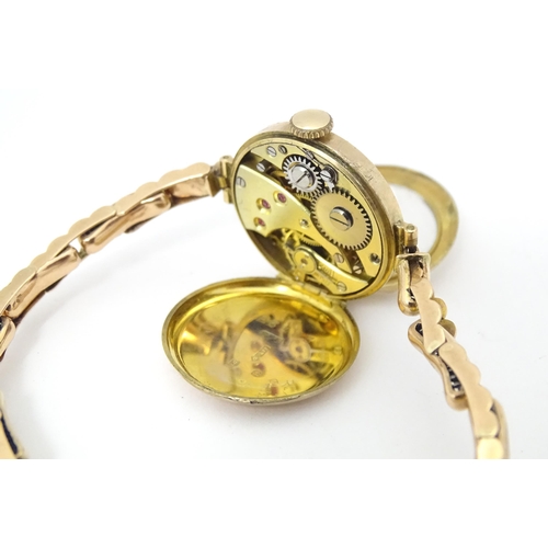 779 - A ladies 9ct gold wristwatch. Dial approx. 3/4