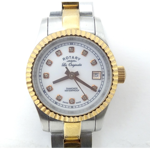 786 - A ladies Rotary 'Les Originales' diamond set wrist watch, with box and guarantee.