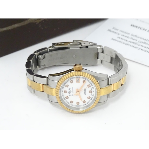 786 - A ladies Rotary 'Les Originales' diamond set wrist watch, with box and guarantee.