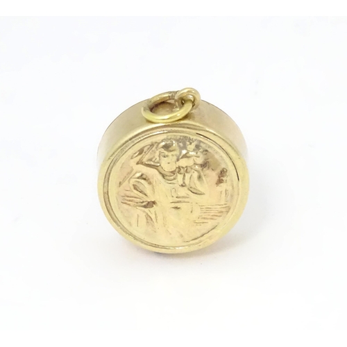 791 - A 9ct gold pendant / charm with St Christopher to one side and inset miniature compass to other. App... 