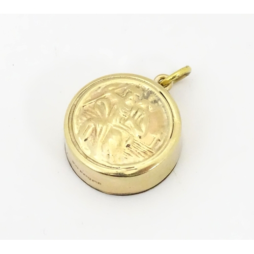 791 - A 9ct gold pendant / charm with St Christopher to one side and inset miniature compass to other. App... 