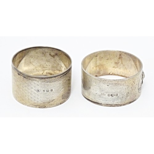 312 - Two silver napkin rings, one decorated with relief detail depicting a bear in a landscape, hallmarke... 