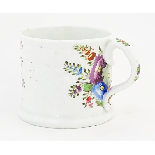 152 - A 19thC mug with hand painted floral and foliate decoration. Approx. 3