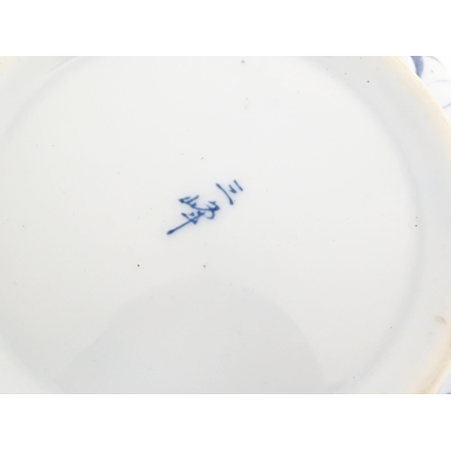 49A - A Japanese blue and white bowl with floral decoration and petal brushwork detail. Character marks un... 