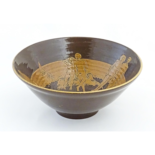 82 - A studio pottery bowl by Frank Haynes with sgraffito decoration depicting naturist / nude figures on... 