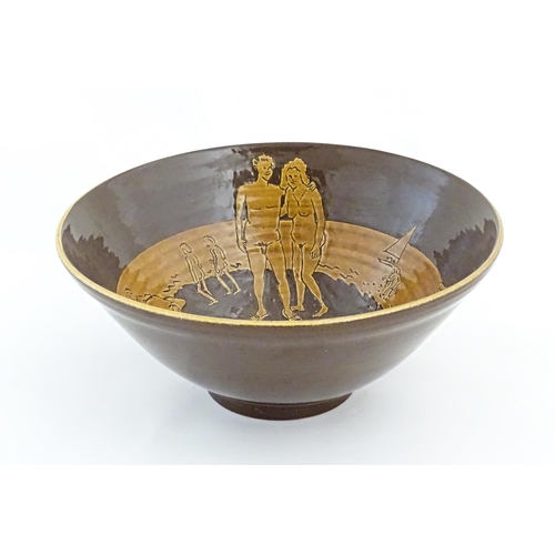 82 - A studio pottery bowl by Frank Haynes with sgraffito decoration depicting naturist / nude figures on... 