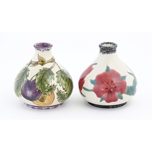 83 - Two Cobridge Pottery squat vases, one decorated with fruit, the other with flowers. Marked under. Ap... 